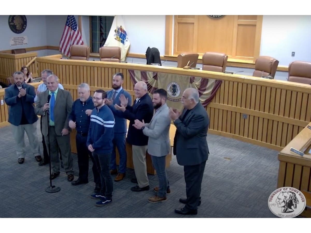 Matthew Roszkowski (in the striped shirt), his family and girlfriend presented plaques to  Toms River Fire Companies 1 & 2, Silverton EMS, Toms River police and community service officers, and Robert Wood Johnson Paramedics. 
