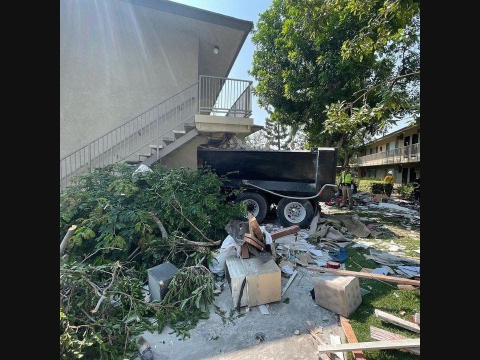 A dump truck crashed into the Coriscan Apartment Homes in Anaheim Tuesday, killing one of the residents who lived in the apartment complex.