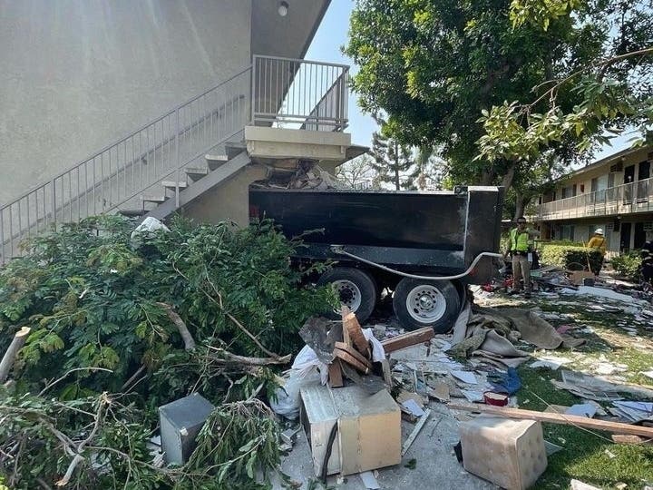 The dump truck reportedly careened off state Route 57, striking two cars before barreling through an apartment complex on Sunkist Street in Anaheim.