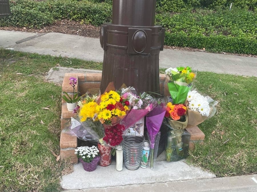 After Rancho Santa Margarita resident Emma Contino placed flowers near the site where an unidentified woman was killed by a car, the offerings of candles and bouquets increased throughout the day.