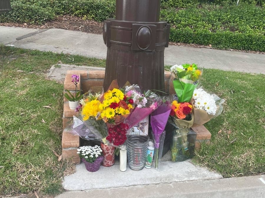 After Rancho Santa Margarita resident Emma Contino placed flowers near the site where a woman was killed by a car, the offerings of candles and bouquets increased throughout the day.