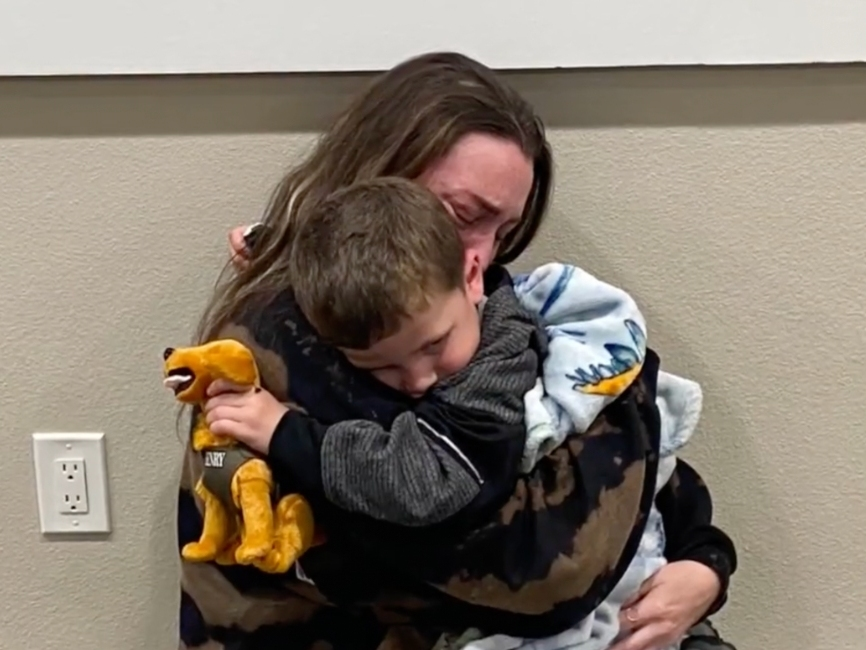 Amanda Ennis, Noah's mother, gives him a tight and tearful hug after her toddler went missing for roughly two weeks. 