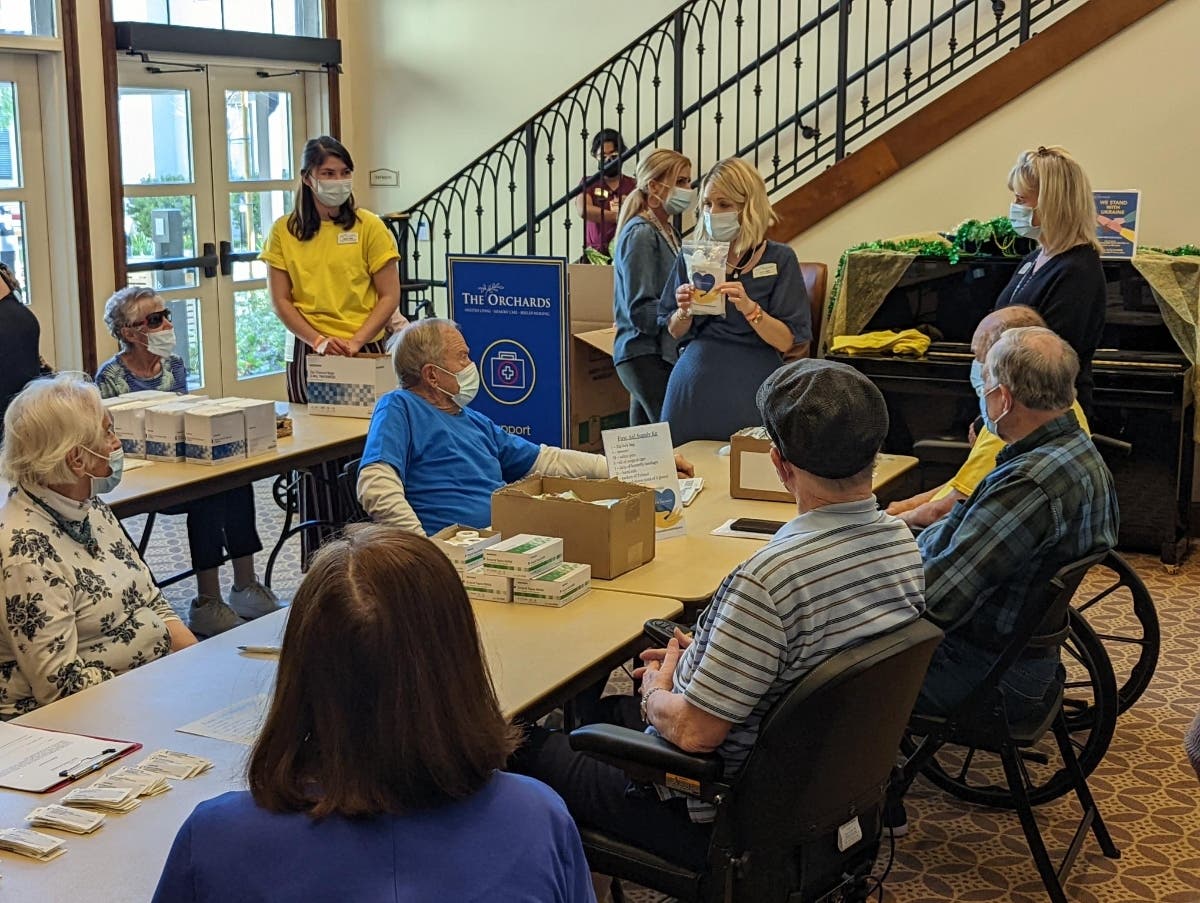 Seniors living at the Orchards Health Center in Rancho Mission Viejo rallied together by donning blue and yellow Tuesday to show solidarity with the people of Ukraine, who face an uncertain future amid a Russian invasion. 