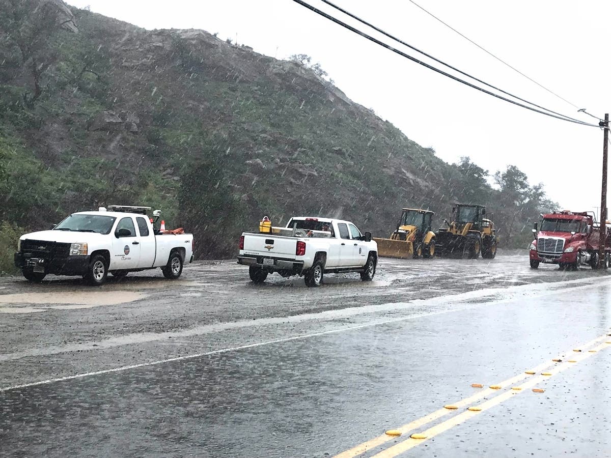 Orange County canyon residents faced a mandatory evacuation order by authorities as a spring storm pounds through southern California Monday, bringing flash flood warnings and wind advisories across the Southland.