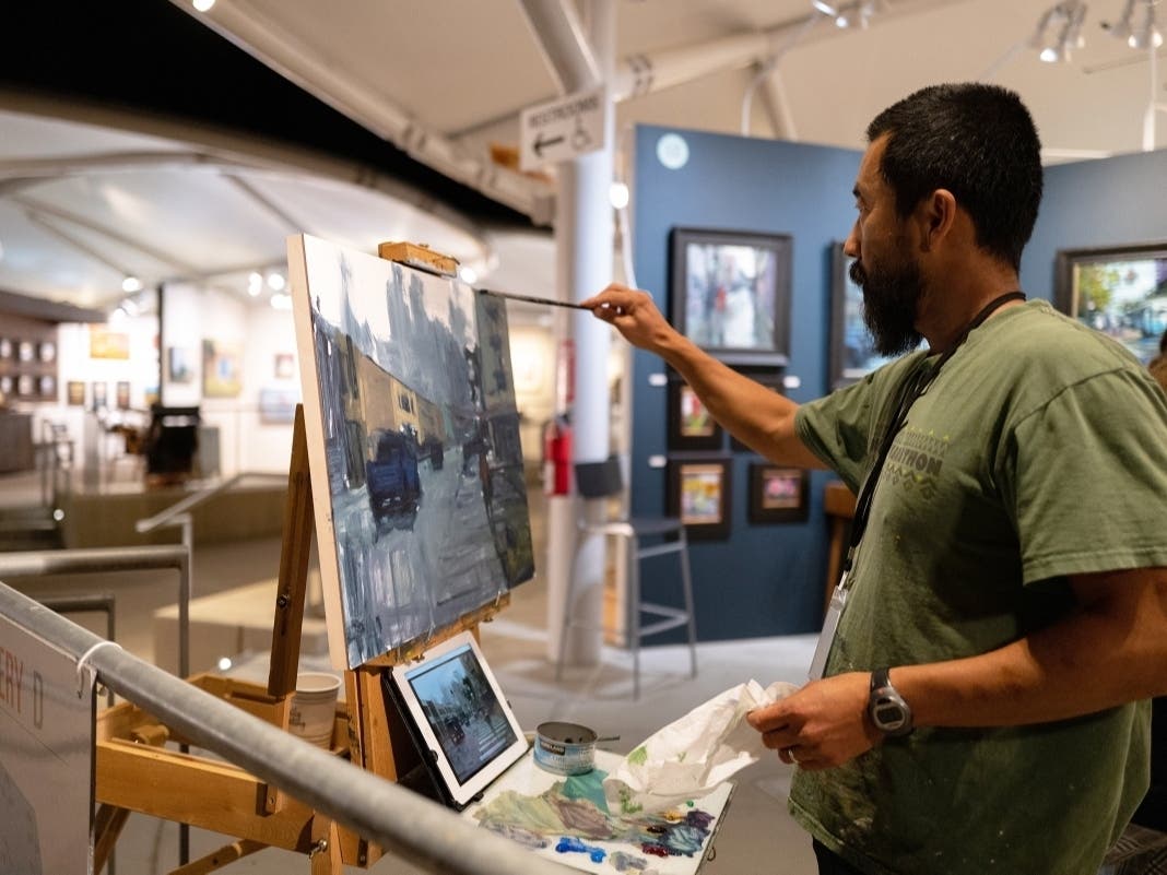 Southern California artist Pil Ho Lee participates in a painting demo during the Festival of Arts.