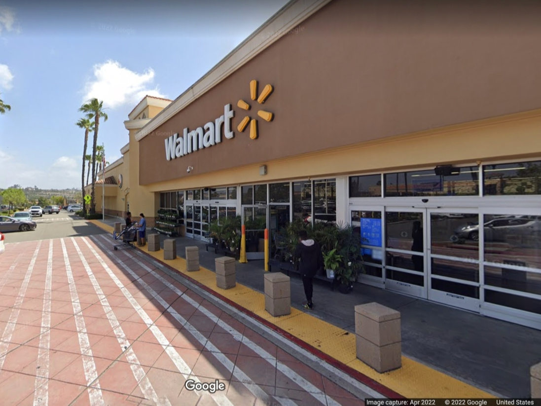 An Orange County Sheriff's deputy fired at the man, a probationer, for driving his car toward an investigator at a Walmart parking lot in Laguna Niguel.