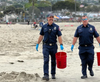 Dozens of Laguna Beach residents, firefighters and city workers gathered at the city's Main Beach last Saturday to participate in the International Coastal Cleanup Day at Main Beach. 