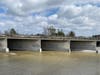 A boy who fell into the Santa Ana Riverbed when he got too close to the water's edge was rescued by a bystander who spotted the child floating down river Sunday.