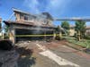 Orange County firefighters battled a garage fire that extended into a house in Coto de Caza Monday. 
