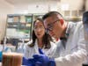 Postdoctoral fellow Xiaoqiang Wang and research associate Yin Chan study the potential of white button mushrooms to treat prostate cancer. 