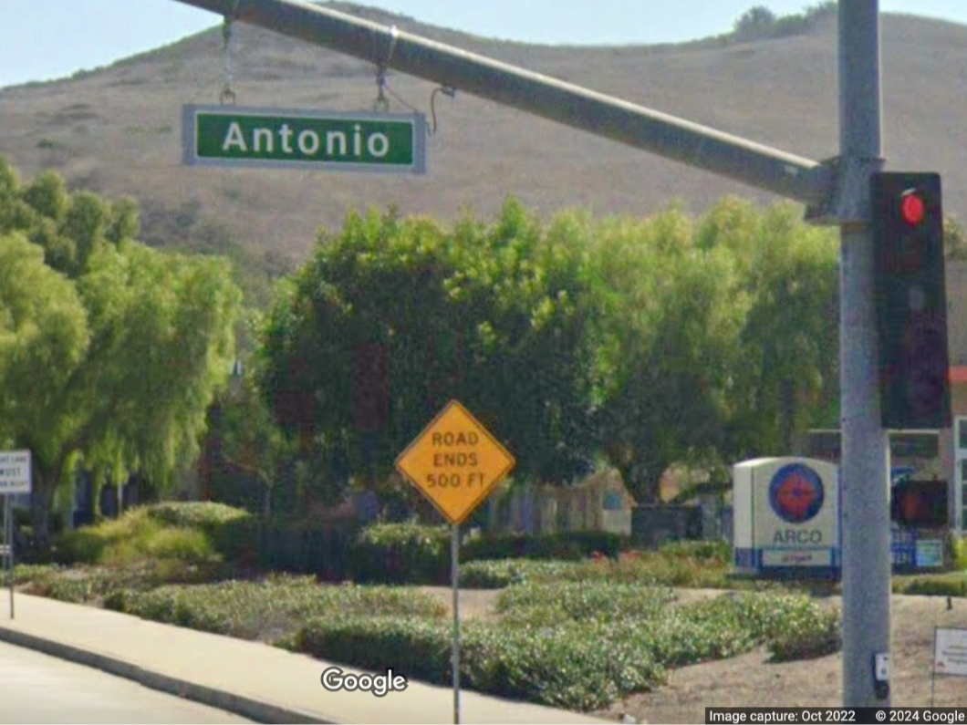 A woman was charged Tuesday was attacking two co-workers with a knife in a south Orange County restaurant last month.