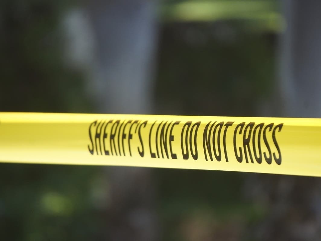 A man who was reportedly attacking a woman in Irvine was shot by police officers Thursday afternoon, authorities said.
