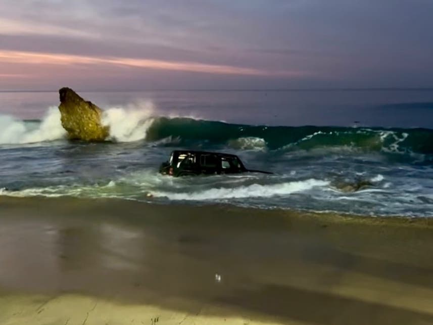 Newport Beach fire crews rescued a driver whose vehicle was found in ocean waters in Corona del Mar on Saturday, authorities said. 