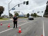 Garden Grove Police Department Officer Erik Palacios turning away traffic at the now expanded evacuation zone Friday.