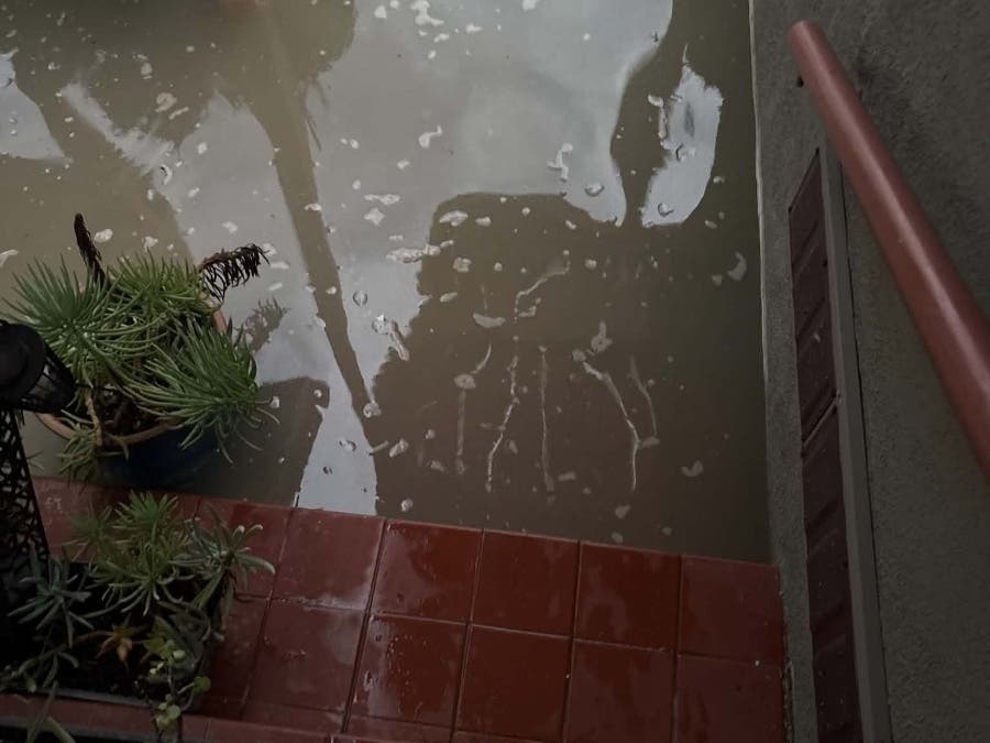 Seal Beach cleanup crews and residents worked through Monday to clear debris, after reports of flooding caused by a breached sand berm sent ocean water onto the boardwalk over the weekend.