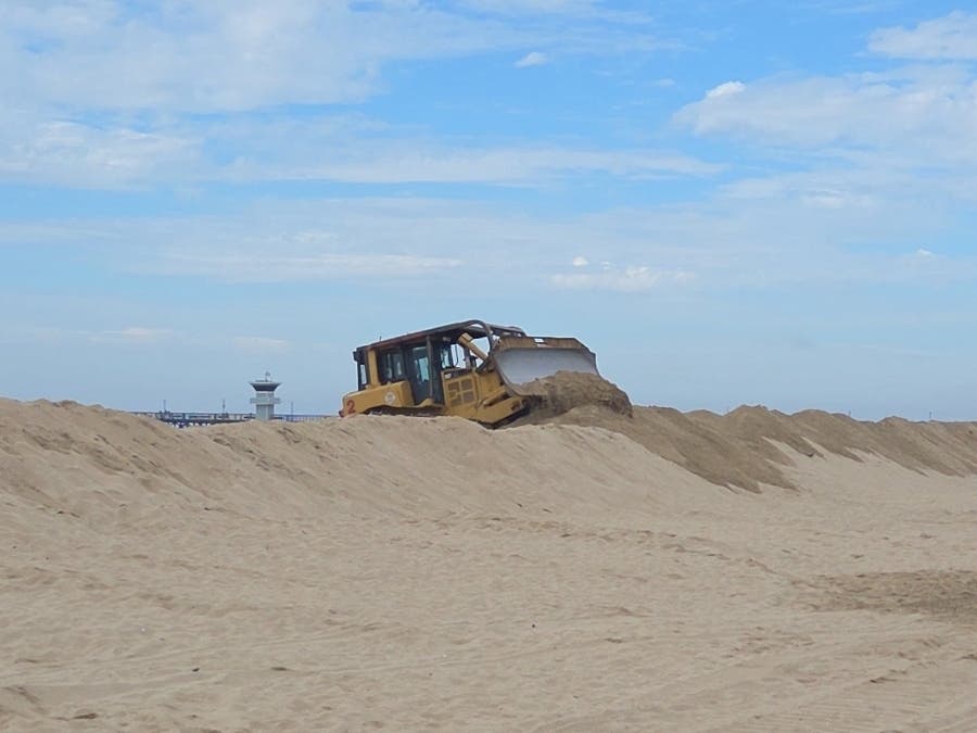 Heavy equipment operators from the Orange County Fire Authority collaborated with Seal Beach Public Works to build a berm to protect homes from the predicted high surf and tides this weekend.
