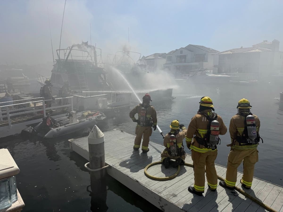 The fire was reported at 1:05 p.m. Wednesday afternoon, when Huntington Beach firefighters responded to a boat fire involving two vessels tied together at a residential dock in the 16000 block of Ardsley Circle.