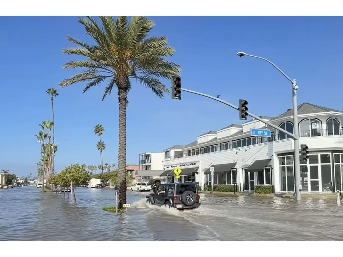 The flooding was reported throughout Balboa Peninsula, and residents were urged to exercise caution.