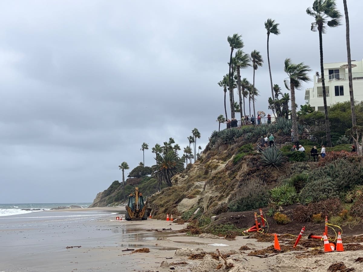 City crews were hard at work through the weekend reinforcing a steep, roughly eight-foot berm along vulnerable portions of Main Beach.