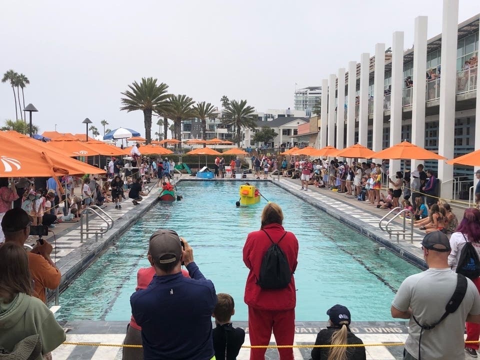Competitors made their way across the pool in their boats or dragging their boats behind in Saturday's cardboard yacht regatta in Santa Monica. 