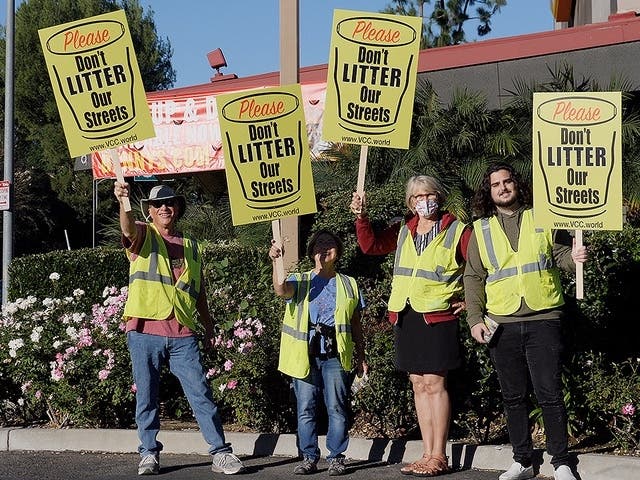 San Fernando Valley volunteers encouraged their neighbors to stop littering and help clean up their neighborhoods at an event on Topanga Canyon Boulevard Friday. 