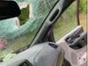A 7-year-old girl, who was sitting in the backseat of the Dodge Caravan, was injured by flying glass after the rock smashed through the windshield, state troopers said.