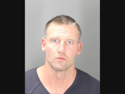Kyle Garrett Rasmussen, 41,​ was charged with assault with intent to do great bodily harm less than murder or by strangulation, the sheriff's office said. He was placed in the Oakland County Jail with a $25,000 bond.