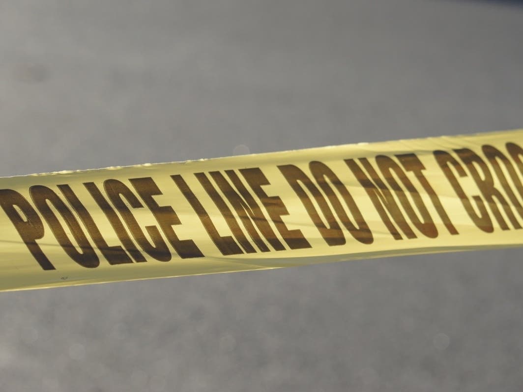 A woman was killed Friday morning after she was struck by a Detroit Department of Transportation bus in downtown Detroit, officials said.
