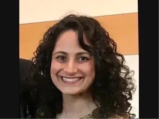 Officers found Woll, 40, dead from multiple stab wounds early Oct. 21 outside her home in the 1300 block of Joliet Place, a neighborhood just east of downtown​.