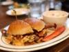 Some of the highlights include deep-fried deviled eggs topped with candied bacon, fried green tomatoes, its signature chicken and waffles, oxtails, shrimp and grits.