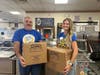 Rotary Club of Enfield President Aimee Nieroda and Rotary Board member Joe Muller delivered meal packets to Loaves and Fishes. 