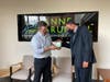 Goodtimer co-creator Adam Ashley shows AAEDC CEO Ben Birge how the "positive parenting device" works.
