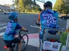 Landon Cook, Matthew Cook and Bryce Cook at an intersection in Granby along the Farmington Canal Heritage Trail. Each family member is riding 325 miles for children's cancer research 