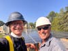 The Rev. Jon Strand and Bob Pegnato of Structual Solar, LLC  over the new solar array. 