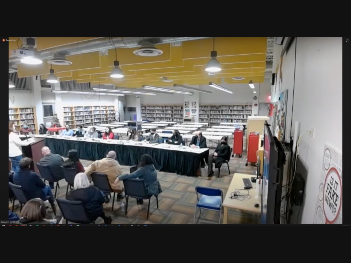 The December 13 Babylon Board of Education meeting took place in Babylon High School's library. Many attendees said not all present were allowed inside due to limited capacity. 