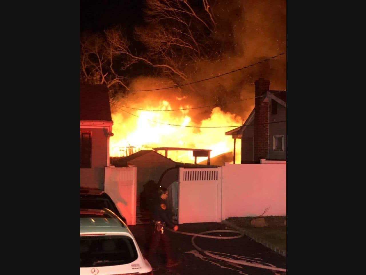 The fire engulfed a detached garage, shed, boat, trailer and motorcycle, but not the actual house, officials said.