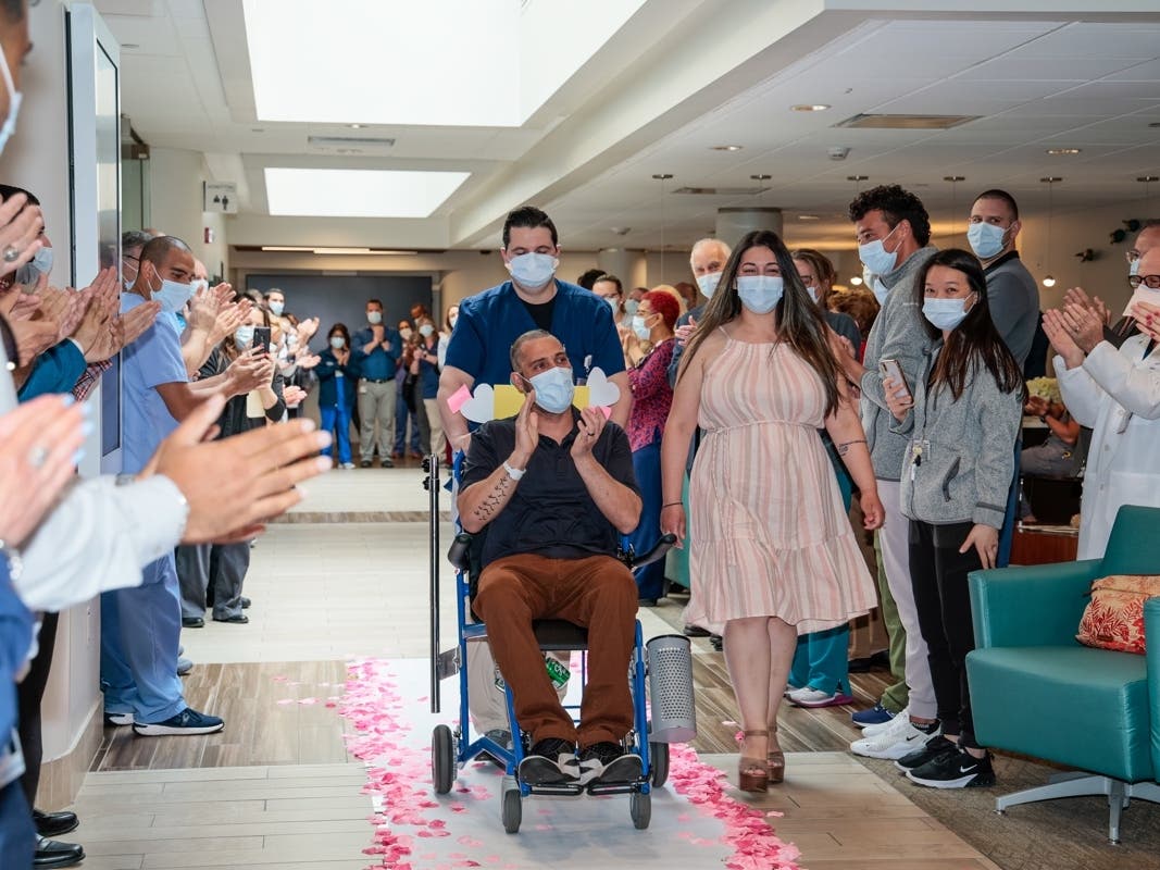 South Shore University physicians, nurses, and hospital staff applauded Luis Pagan and his family at a "clap-out" on Friday.