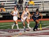 Senior Kasey Prybylski (24) and Ashley Malatak (34) control the center of the field.