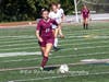 Catherine Hayes carries the ball with speed.