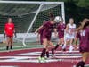 Catherine Hayes heads the ball out of the box.