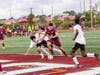 Steven Zuniga scores with defenders all over him.