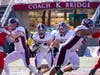 Matthew Kephart (24) hits the hole behind the blocks of Sawyer Olson (78) and Andrew Cresciullo (68)