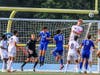 Ari Rosu (Sr) jumps well above the rest of the pack to clear a corner kick vs. Caldwell