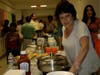 Talented cook Zein Bertacchi at a chess tournament raising funds for flood victims in IL