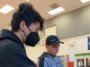 BHS Chess team students, James Zhang and Llameres volunteering as chess tournament directors