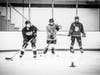 Junior Sharks learning to skate, pass, shoot, and stick-handle from experienced coaches who teach the fundamentals to girls 12 and older. 