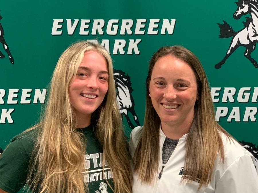 Lily Strand (left) and Michelle Vucsko (right) were all smiles after learning they were named the South Suburban Conference player and coach of the year, respectively.