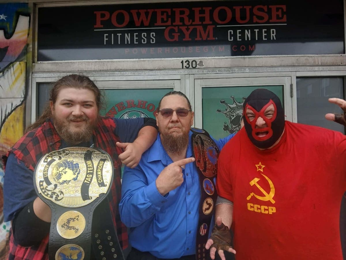 Cletus the wrestler , manager John Lowe, Russian Manimal Volkoff with the AIWF New England Tag Team title Sept 20, 2026 after winning against Sargent Striker and Masked Wrestler 23.