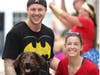 Silk City Fit owners Sara Nagle and Cory Fullana pose with their dog, Kai