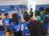 Teen campers and City of Fort Lauderdale Police officers discuss strategy before the game begins